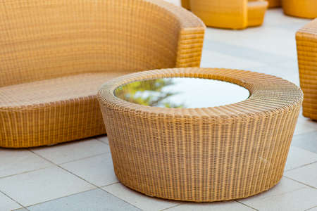 outdoor summer terrace, with stylish rattan furniture, in a cafe at sunsetの写真素材