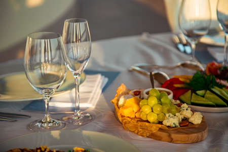 beautiful table setting, with dishes and food in a summer restaurant