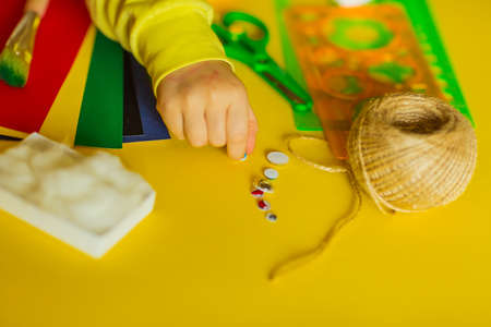 step by step instructions, colored paper application, Easter bunny, made by children's handsの写真素材