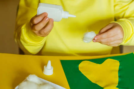 step by step instructions, colored paper application, Easter bunny, made by children's handsの写真素材