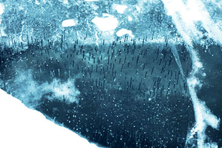 natural, winter background, texture frozen water, ice with bubbles and stripes, blue with white...