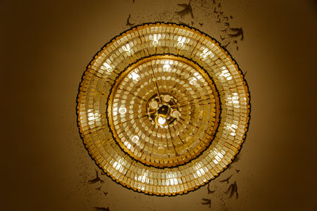 Designer chandelier with burning light bulbs,on the ceiling,bottom viewの写真素材