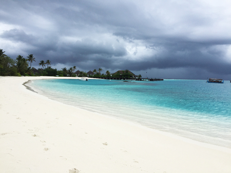 The white sand beach at Maldives on an overcast dayの写真素材