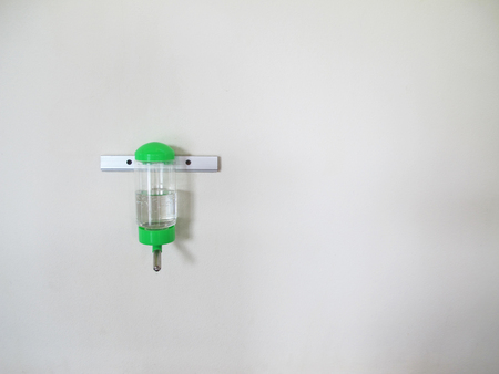 Water bottles for pet on the wall