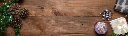 Tree fir snow candy and decor on wooden table. Top view with copy space, border design panoramic...