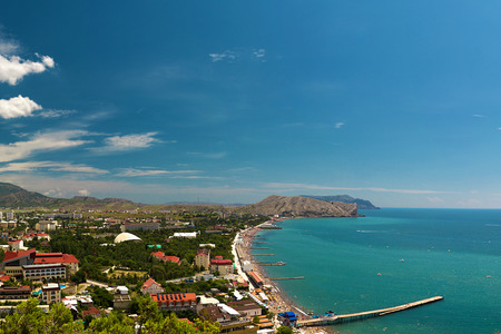 Panorama of the resort town of Sudak in the Crimea. Beautiful summer marine landscape. Travel photos