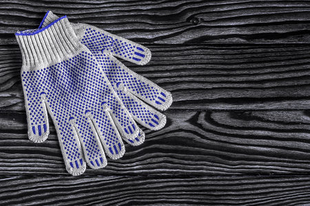 gardening tools concept. Gloves on wooden background with space for text flat lay top view. Trendy Toned in Color of the year 2022, Very Peri.の写真素材