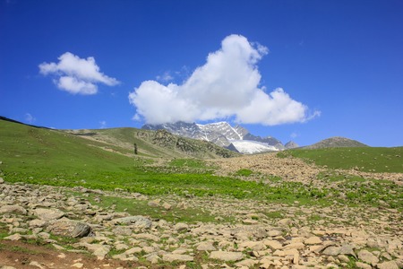 Spring in the valley / snow melting in the mountainsの写真素材