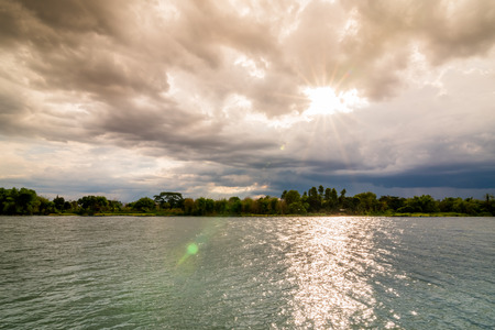 Evening storm over watershed and dramatic sky and cloudsの写真素材