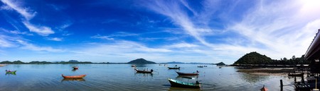 Long tail boat on beach on sunset on ebb. Thailandの写真素材