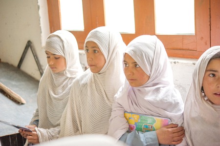 SKARDU, PAKISTAN - APRIL 18: An unidentified Children in a village in the south of Skardu are learning in the classroom of the village school April 18, 2015 in Skardu, Pakistan.のeditorial素材