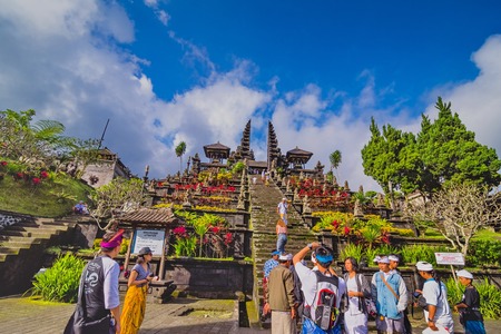 BESAKIH TEMPLE, BALI, INDONESIA-AUGUST 13 : People go down after praying in Besakih temple on August 13, 2016 in Bali, Indonesia. Besakih temple is one of the most famous hindu temple in Bali islandのeditorial素材