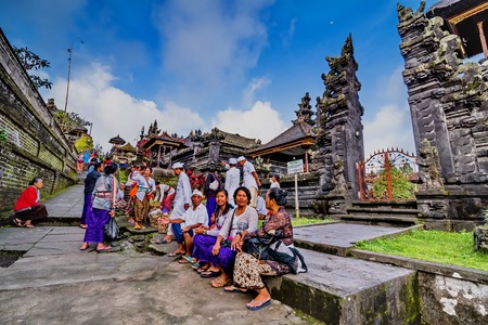 BESAKIH TEMPLE, BALI, INDONESIA-AUGUST 13 : People go down after praying in Besakih temple on August 13, 2016 in Bali, Indonesia. Besakih temple is one of the most famous hindu temple in Bali islandのeditorial素材