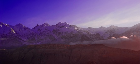 beautifull cloudy sunrise in the mountains with snow ridge