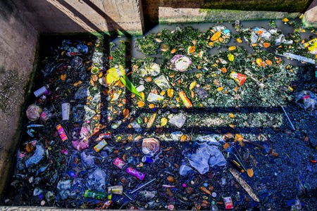 BANGKOK, THAILAND - JANUARY 12 : Trash keeper thai man collect garbage in underwater at wastewater and pollution water in canal for sale on January 12, 2017 in Bangkok, Thailandのeditorial素材