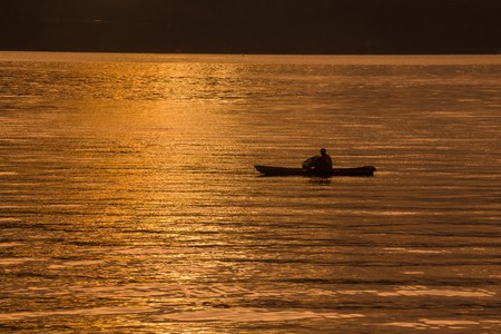 Sunset Sunrise with reflections at Lake Toba, Samosir Island, Indonesia.の写真素材