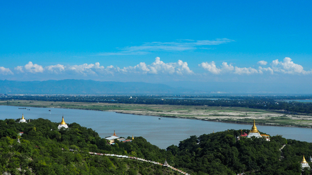views of multiple temples and pagodas on the mountain with Irrawaddy river in the background from sagaing hill, Sagaing region of myanmar.の写真素材