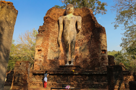 Old Buddha statue in Wat Phra Si Iriyabot in the Kamphaeng Phet Historical Park, Thailand.の写真素材