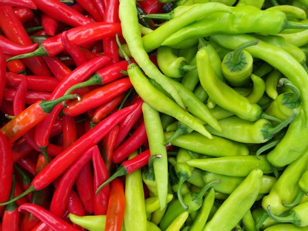 culinary background of fresh hot green red chilliesの写真素材