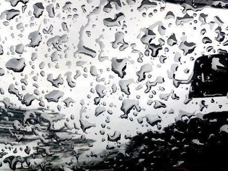 Water Drop on the Hood of the Car. Rain Drops on the Surface of the Car or on the Iron Surface Flow Down. Abstract Background and Water Texture for Design.の写真素材