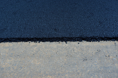 Process of building new asphalt road on the new road construction site in Thailand