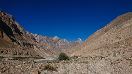 Landscape of K2 trekking trail in Karakoram range, Trekking along the Braldu River in the Karakorum Mountains in Northern Pakistanの写真素材