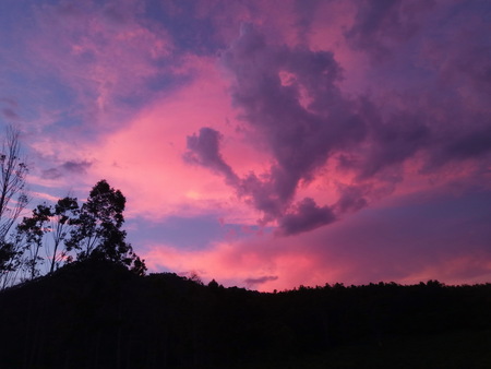 sunset sunrise sky with mountain and treeの写真素材