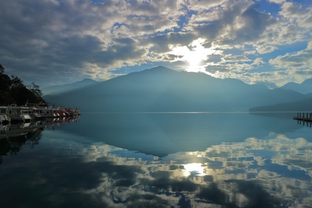 Beautiful landscape view of mountain and lake with reflection in the morning under sky and cloud, Nantou, Taiwanの写真素材