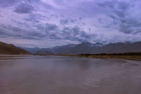 landscape view of the Indus river flowing through Katpana cold desert in Skardu, Gilgit Baltistan, Pakistan.の写真素材