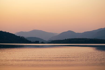 sunset sunrise over river and mountainの写真素材