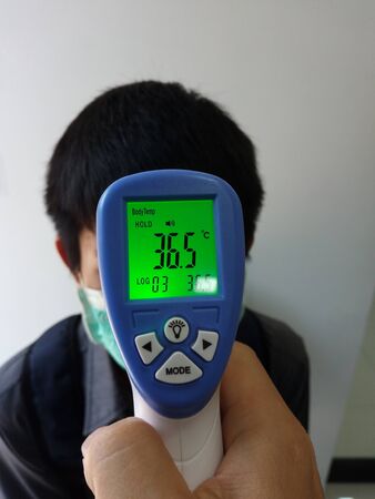 Fever screening for people infected with Covid-19の写真素材
