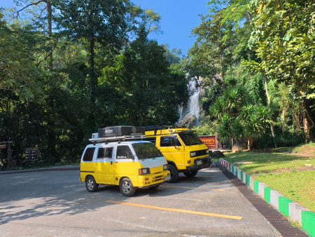 Yellow minivan car on the road.