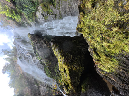 Waterfall in the forest, Mossy rocks and waterfall in the deep forest on the mountainの写真素材