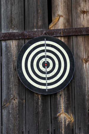 Three darts hit the target of a dart board.の写真素材