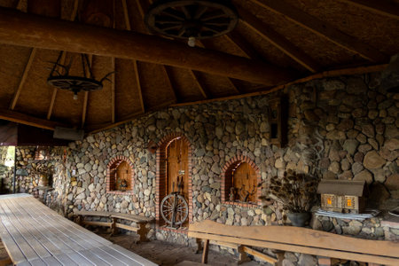 Old restored country house in the estate. Stone building in the countryside in the summer after restorationの写真素材
