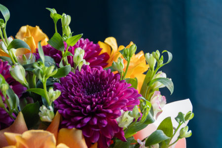 lilac dahlias with yellow roses in a bouquet on a dark background close up. bouquet of dahlias and rosesの写真素材