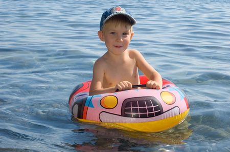 happy boy swimmingの写真素材