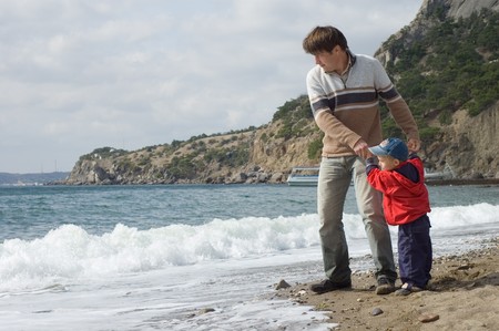 happy father and son on the beachの写真素材