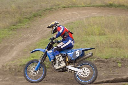 young bider in a cross-country motorcycle race