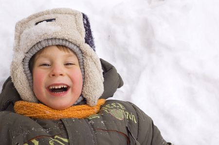 cheerful little boy enjoy winter outdoor