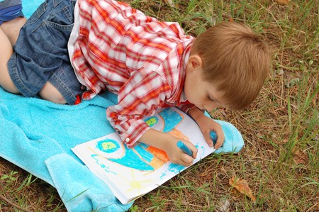 young artist drawing car outdoorの写真素材