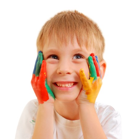 cute little boy with hands in paint isolated on white backgroundの写真素材