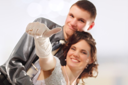 happy just married showing thumbs upの写真素材