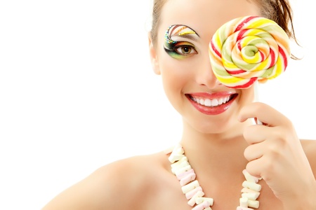 woman laughing with candy and beautiful make-up young attractive isolated on white background woman laughing with candy and beautiful make-up young attractive isolated on white background