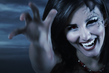 woman beautiful halloween evil vampire over night background