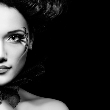 woman beautiful halloween vampire baroque aristocrat over black backgroundの写真素材