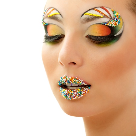 studio beauty portrait of attractive woman with beautiful candy make-up isolated on white backgroundの写真素材