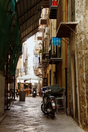 ancient street in Palermo with cobblestone road, Sicily, Italyの写真素材