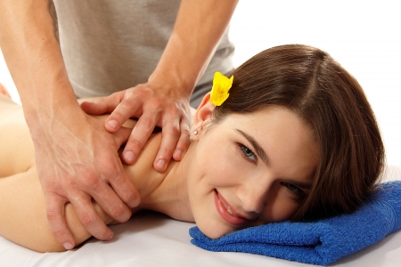 back massage of woman young beautiful cheerful isolated on white backgroundの写真素材