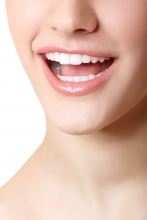 Perfect smile of beautiful woman with great healthy white teeth. Isolated over white background の写真素材